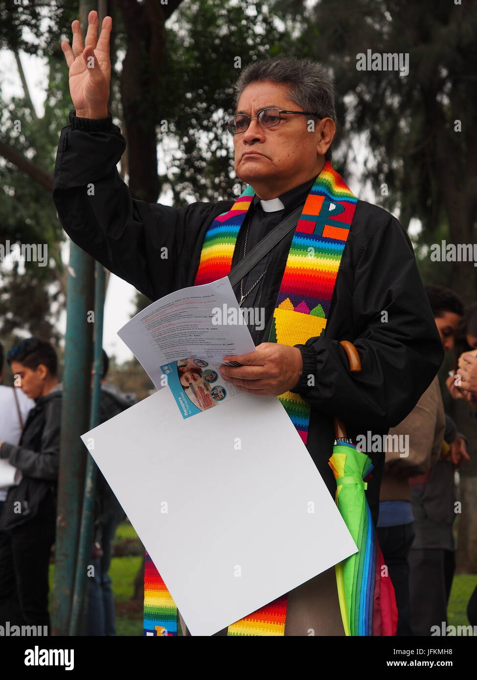 Lima, Peru. 01st July, 2017. Priest of the Inclusive Christian Ecumenical Community giving the blessing. Thousands of activists from the LGBT community and sympathizers participated in the pride parade Lima 2017 in search of recognition of their civil rights and against discrimination. Credit: Fotoholica Press Agency/Alamy Live News Stock Photo