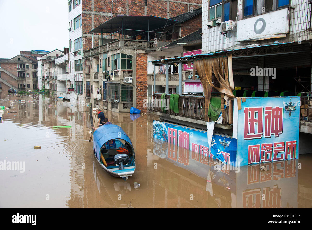 Shaoyang, Shaoyang City of central China's Hunan Province. 2nd July, 2017. A boat patrols to rescue stranded people on a street of Xinshao County, Shaoyang City of central China's Hunan Province, July 2, 2017. Recently Shaoyang witnessed the heaviest flood this year. Credit: Lyu Jianshe/Xinhua/Alamy Live News Stock Photo