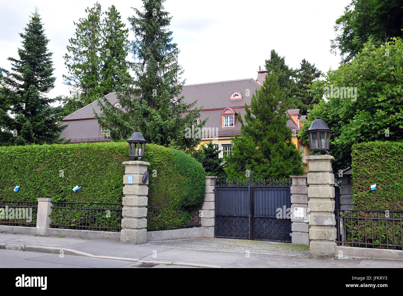 The hedge surrounding the villa of Thailand's Crown Prince, Maha Vajiralongkorn, decorated with little white-blue flags ahead of the Tutzing Fisherman's Wedding Festival in Tutzing at the Starnberger lake in Germany, 02 July 2017. The wedding of a fisherman from 1812 is recreated for a whole weekend every five years in Tutzing. Photo: Ursula Düren/dpa Stock Photo