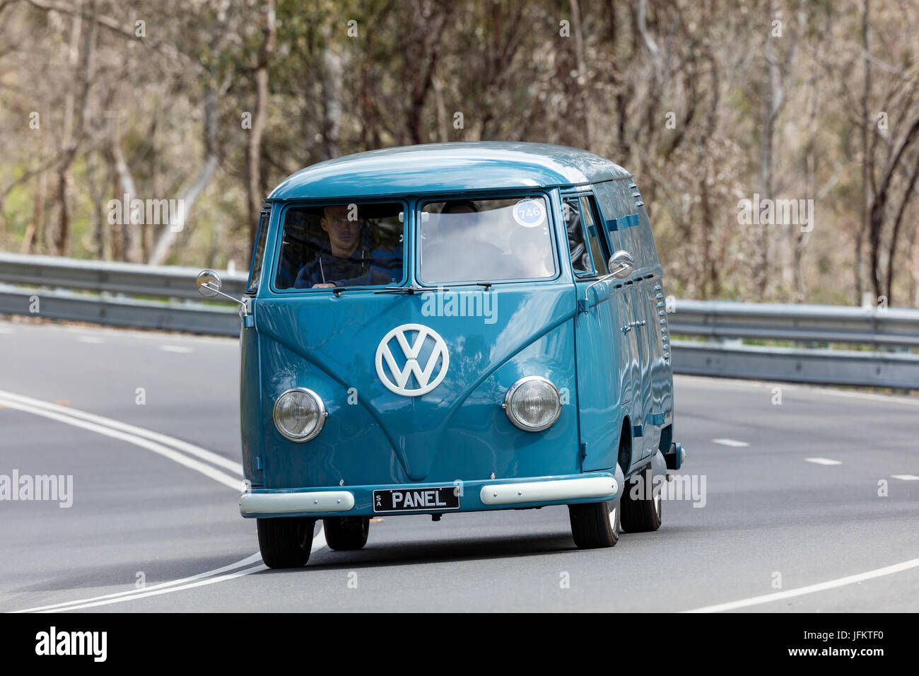 Vintage 1959 Volkswagen Kombi Van driving on country roads near the town of Birdwood, South Australia. Stock Photo