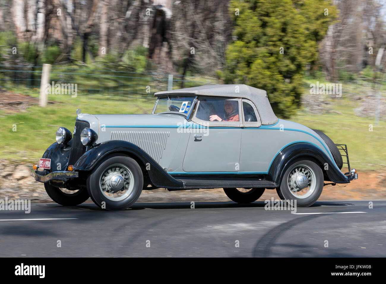 Vintage 1934 Plymouth PF Roadster driving on country roads near the town of Birdwood, South Australia. Stock Photo