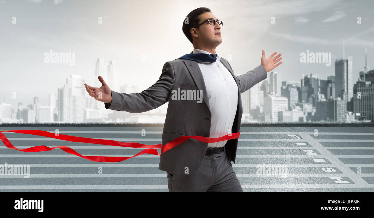 Businessman on the finishing line in competition concept Stock Photo ...