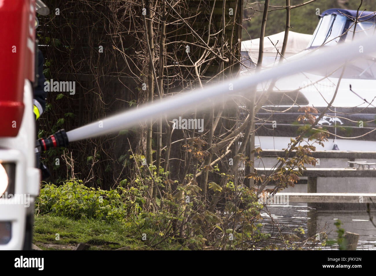 Fire department sprayed extinguishing water during an exercise. Stock Photo