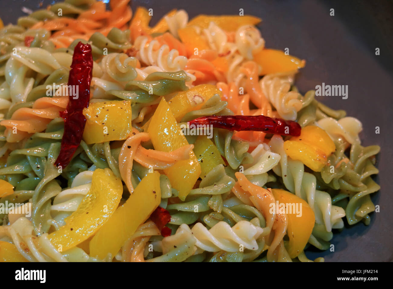 Fusilli pasta with garlic, dried red chili, yellow pepper and olive oil