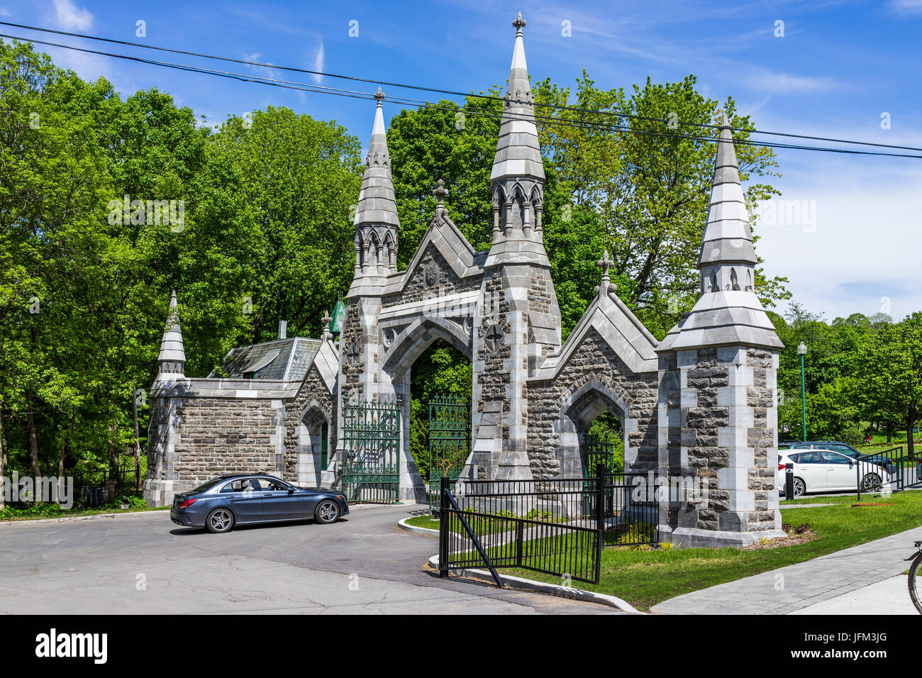 Montreal, Canada - May 28, 2017: Gate of cemetery on Mont Royal during bright sunny day in Quebec region city Stock Photo