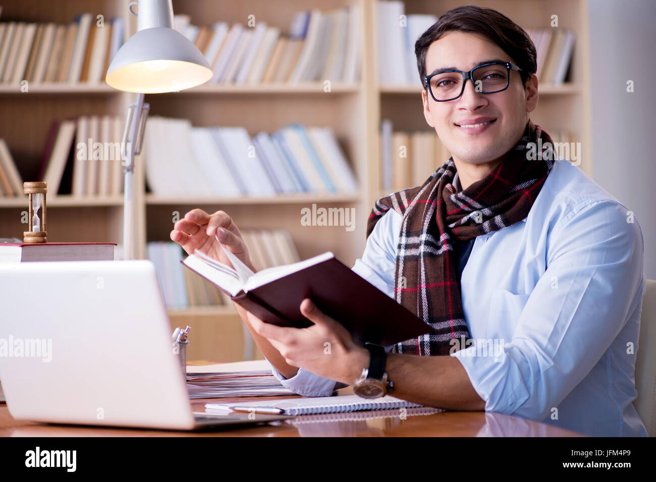Writer In Library Young writer working in the library Stock Photo - Alamy