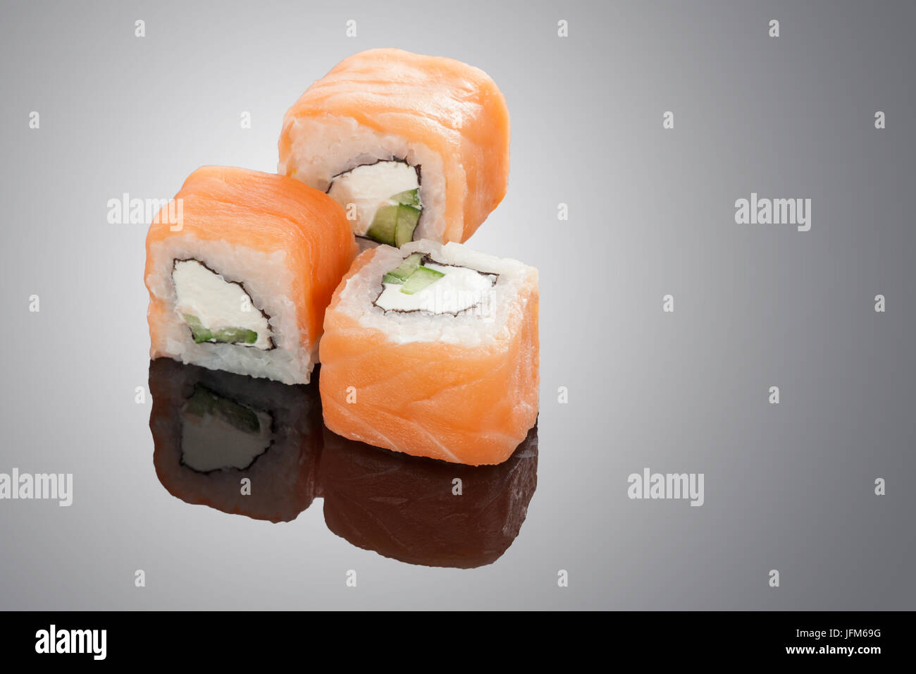Fresh sushi rolls isolated on black background Stock Photo