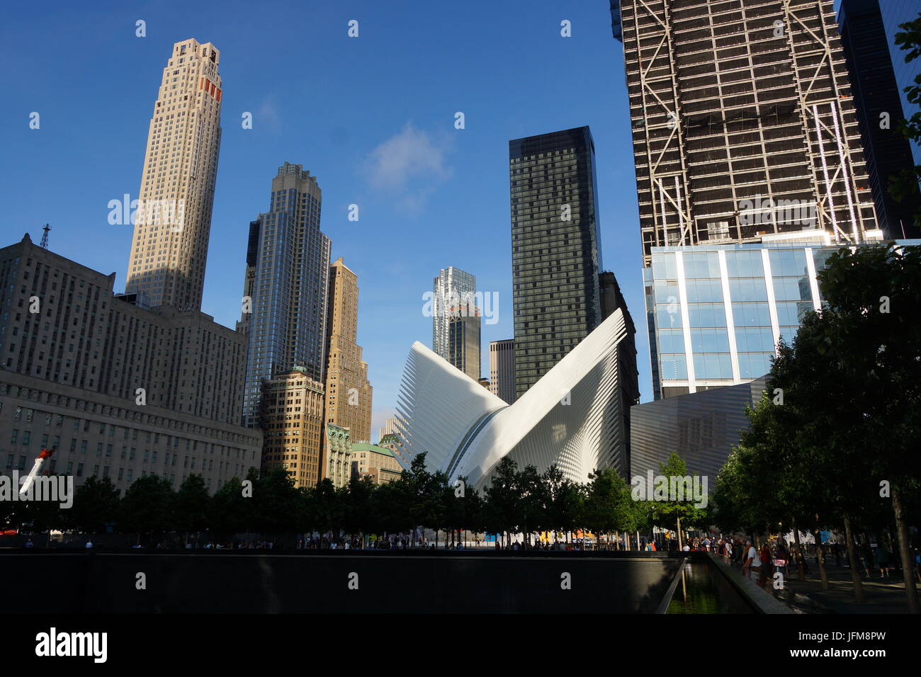Reflecting pool and Oculus transportation hub by One World Trade Center, NY Stock Photo