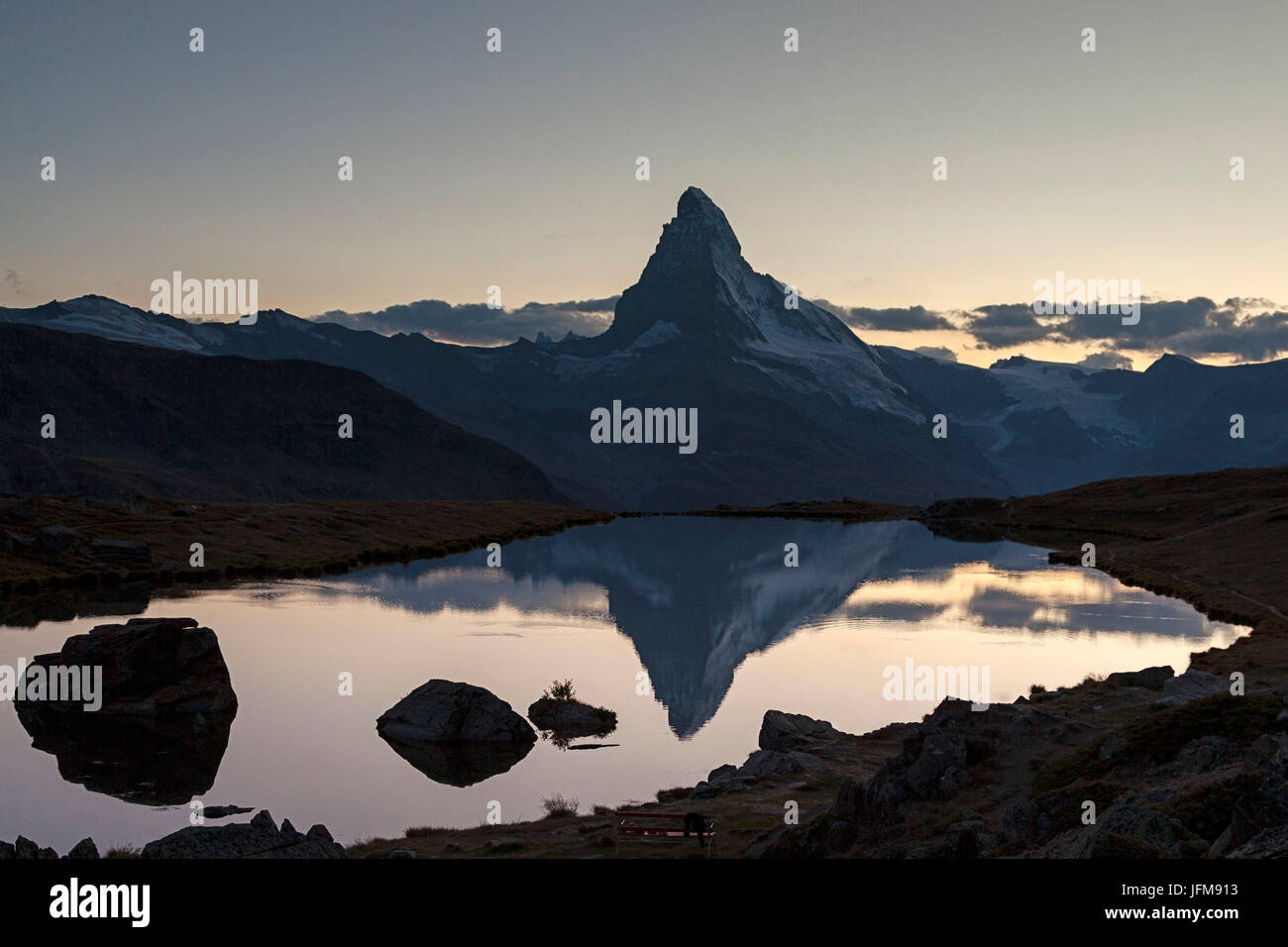 The Matterhorn reflected in lake stellisee the last light of sunset, Zermatt valley, Valais-Wallis Canton, Switzerland Stock Photo