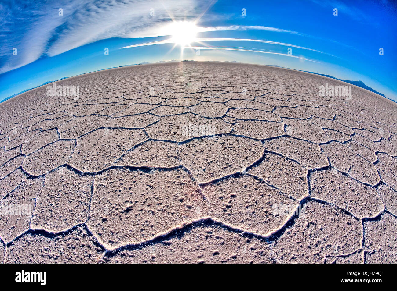 The curvature of the earth is accentuated by fish eye effect in the huge expanse of salt in the Salar de Uyuni, South Lipez, Bolivia, South America Stock Photo