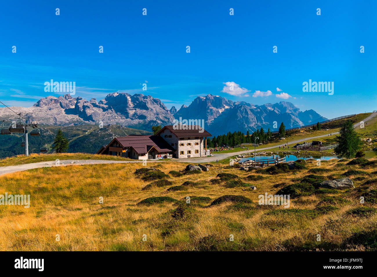 Madonna di Campiglio, Trento, Trantino Alto Adige, Italy The refuge Viviani Pradalago, with its pond, photographed from above, In the background you can see the dolomite of the Brenta, on the right the chairlift Winter Stock Photo