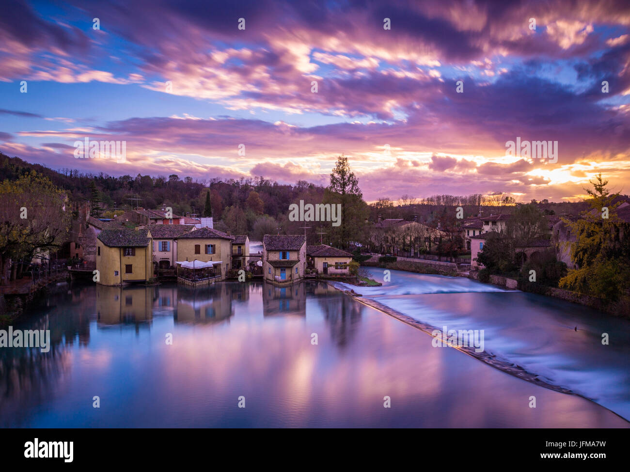 Valeggio sul Mincio, Veneto, Italy, Landscape view of the village during a colorful sunset, Stock Photo