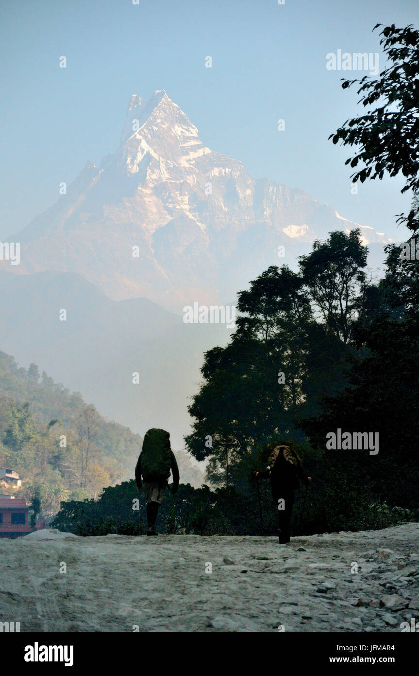 Two trekkers at the foot of the mountain, Pockara, Annapurna, Nepal, Stock Photo
