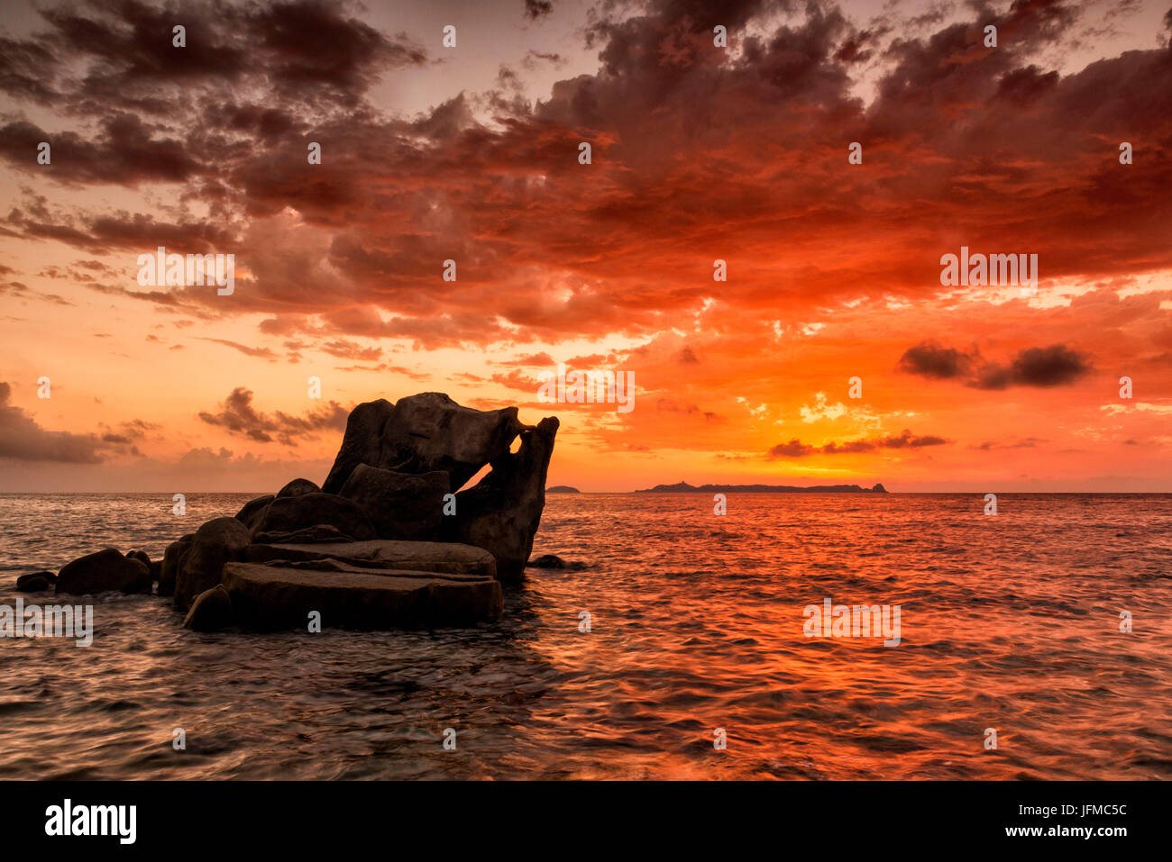 italy, Sardinia, Villasimius, dawn on reefs of Punta Molenti beach, Stock Photo