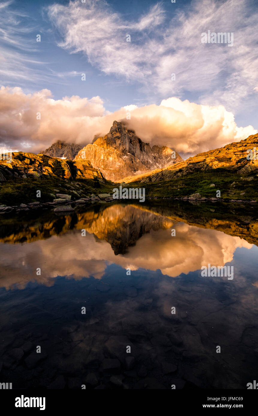 Dolomites, Cimon della Pala, most famous peak of the Pale di San Martins group, reflected on one of Cavallazza Lakes, Stock Photo