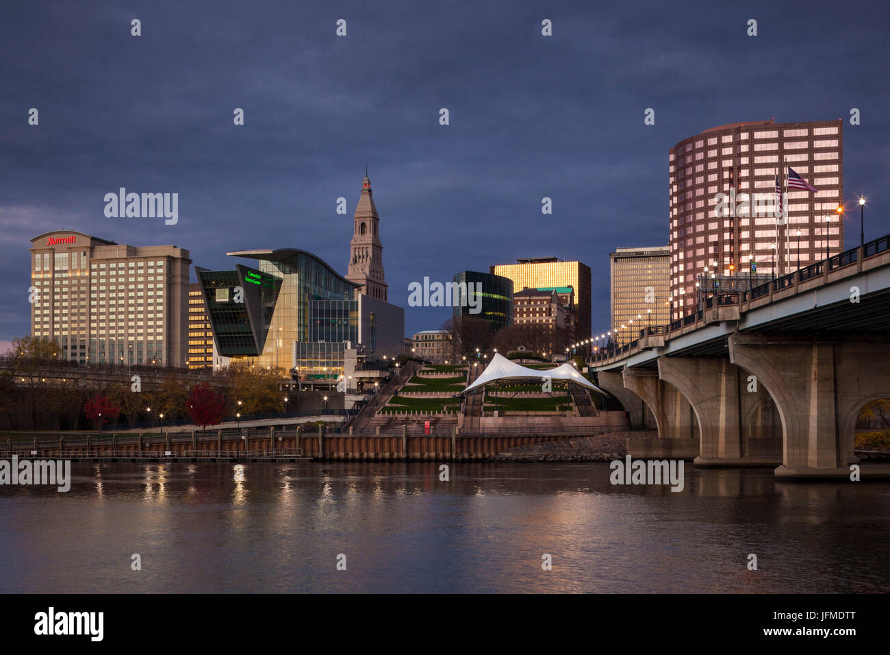 USA, Connecticut, Hartford, city skyline with Connecticut Science Center and Travelers Building, from the Connecticut River, dawn, autumn Stock Photo