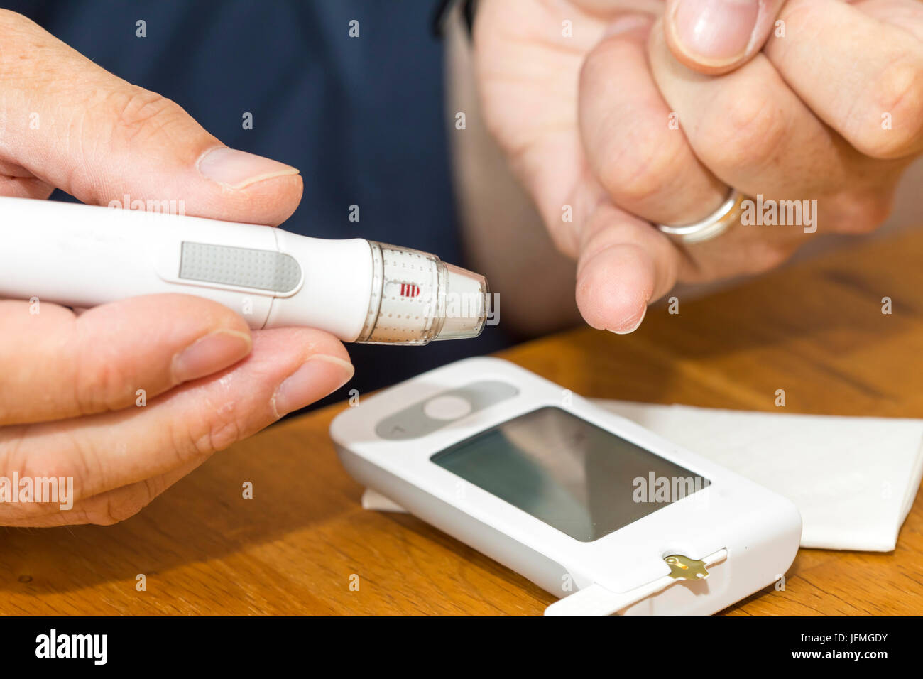 Diabetics with a blood glucose test, with a lancing device a blood drop