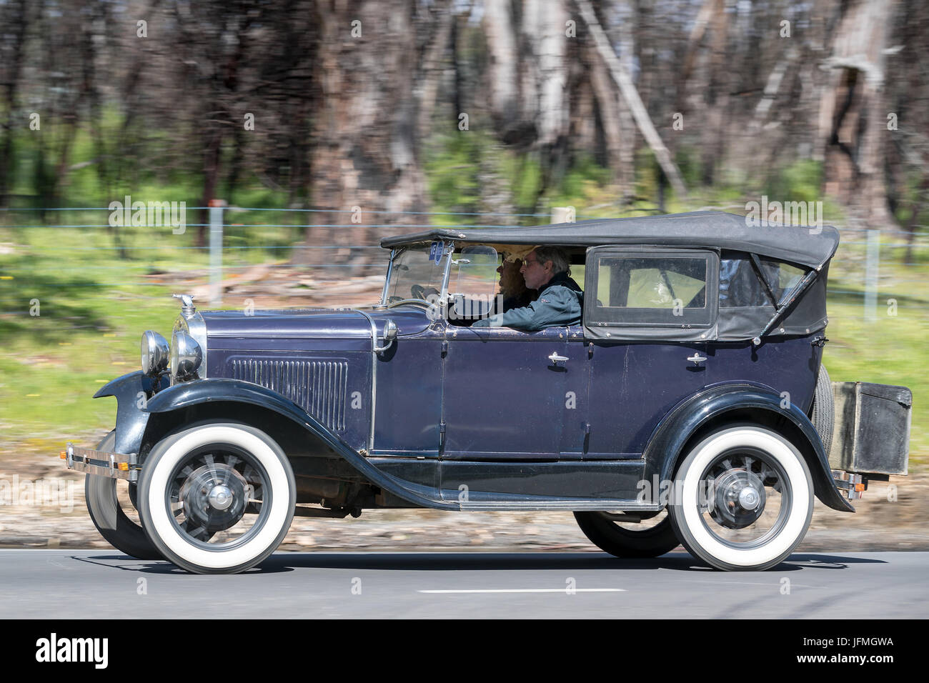 Vintage 1930 Ford Model A Phaeton driving on country roads near the town of Birdwood, South Australia. Stock Photo