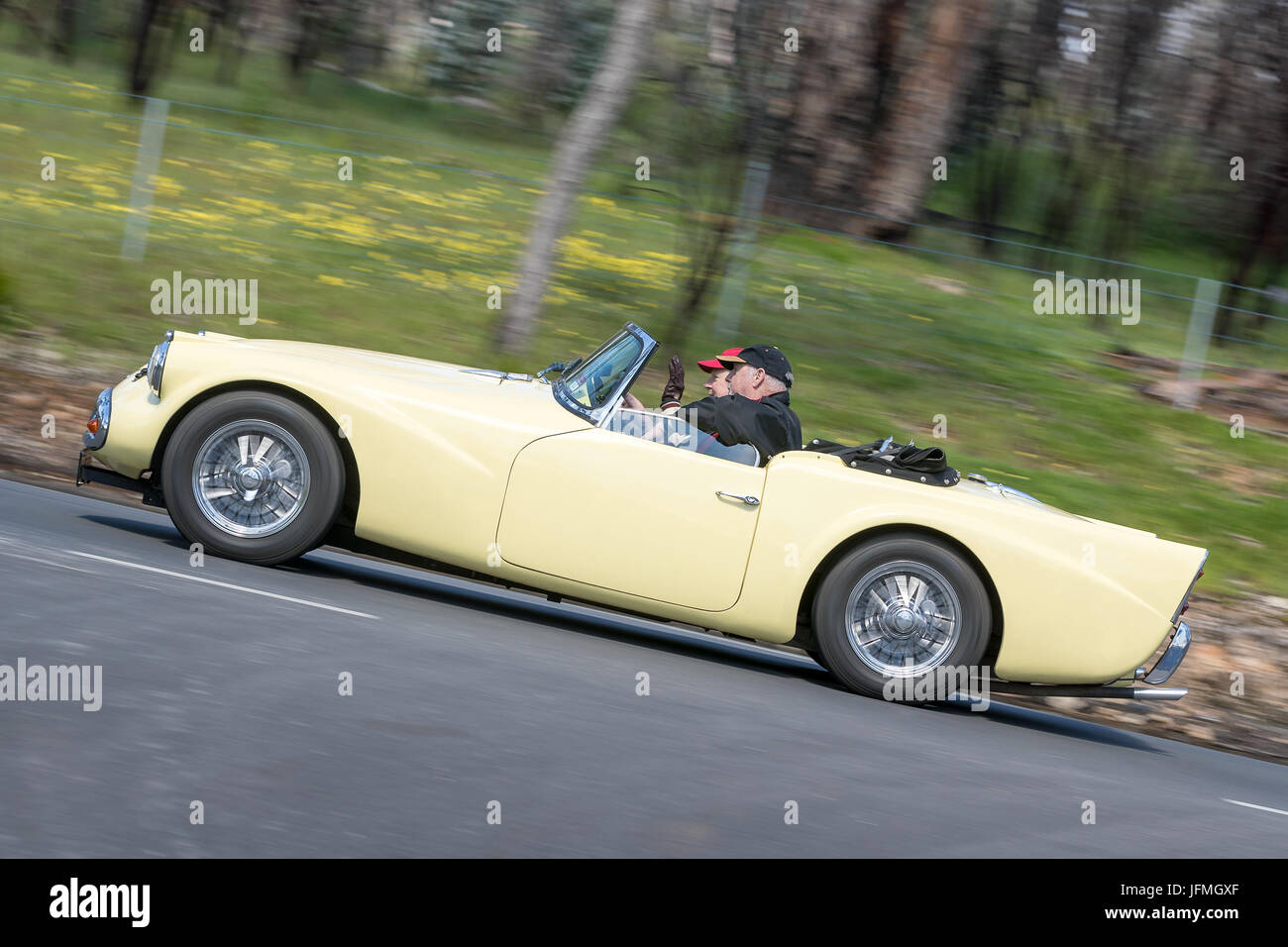 Vintage 1959 Daimler SP 250 Roadster driving on country roads near the town of Birdwood, South Australia. Stock Photo