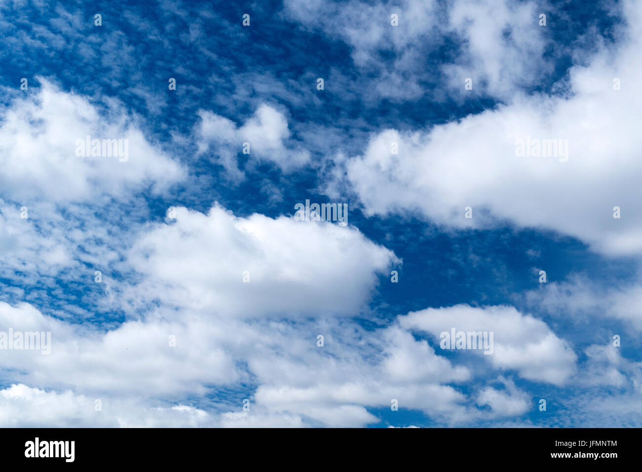 White clouds under a classic blue sky in Northern England Stock Photo