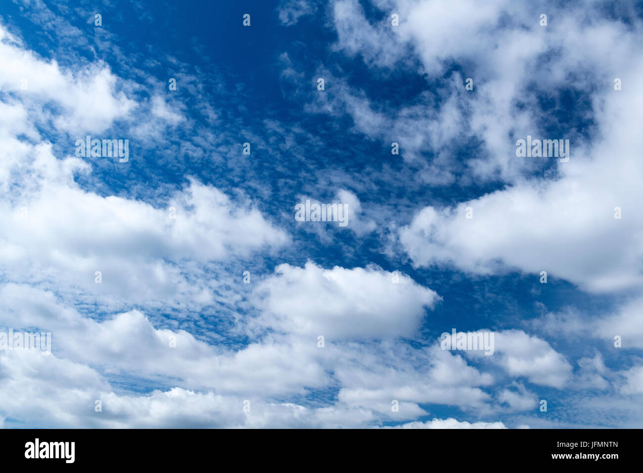 White clouds under a classic blue sky in Northern England Stock Photo