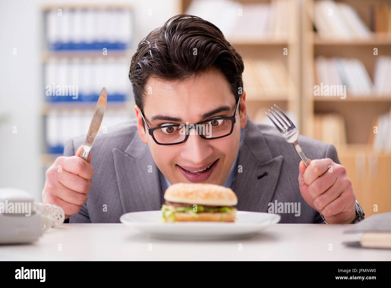 Hungry Funny Businessman Eating Junk Food Sandwich Stock Photo Alamy hungry-funny-businessman-eating-junk-food-sandwich-stock-photo-alamy