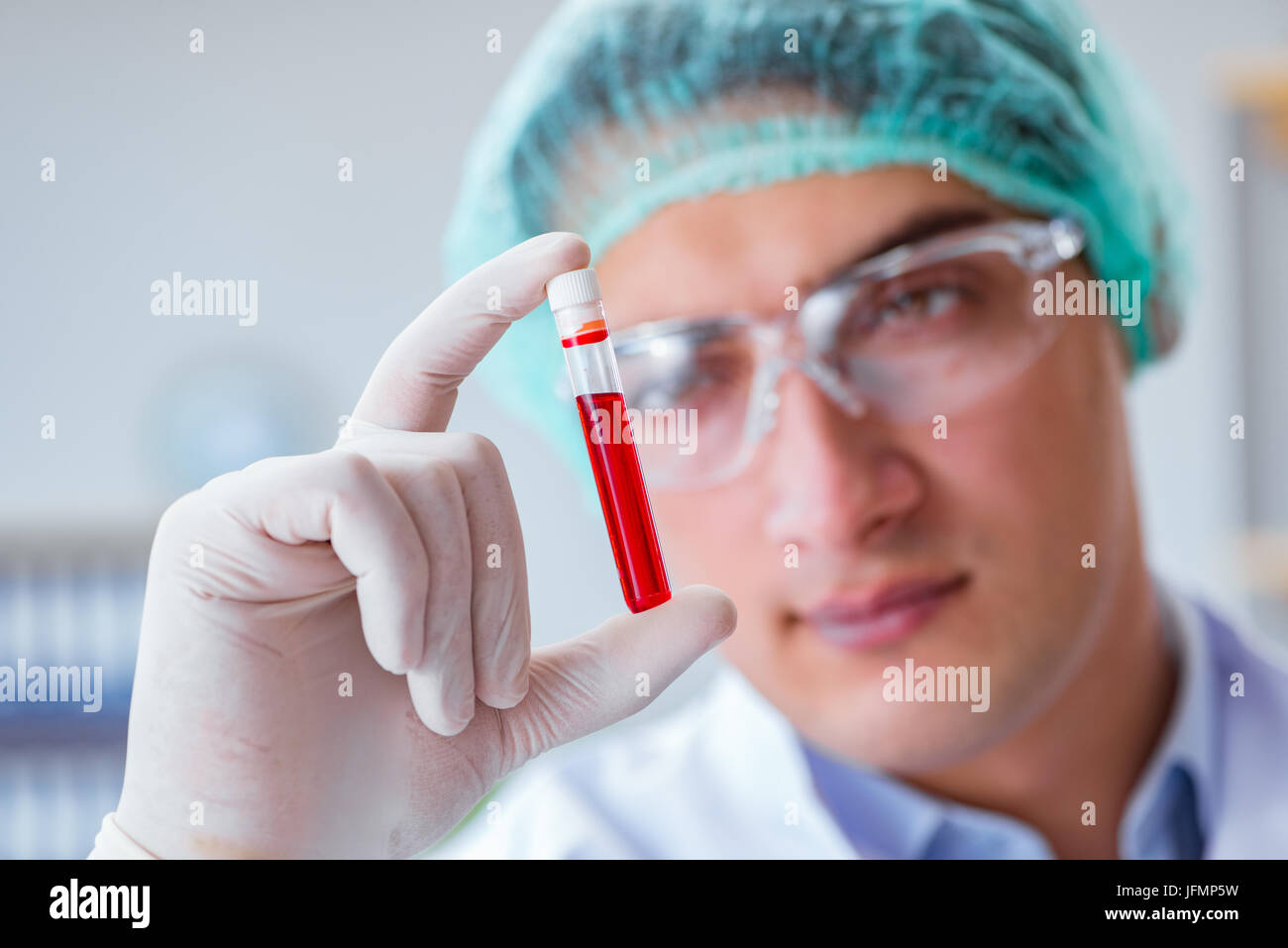 Young doctor working on blood test in lab hospital Stock Photo - Alamy