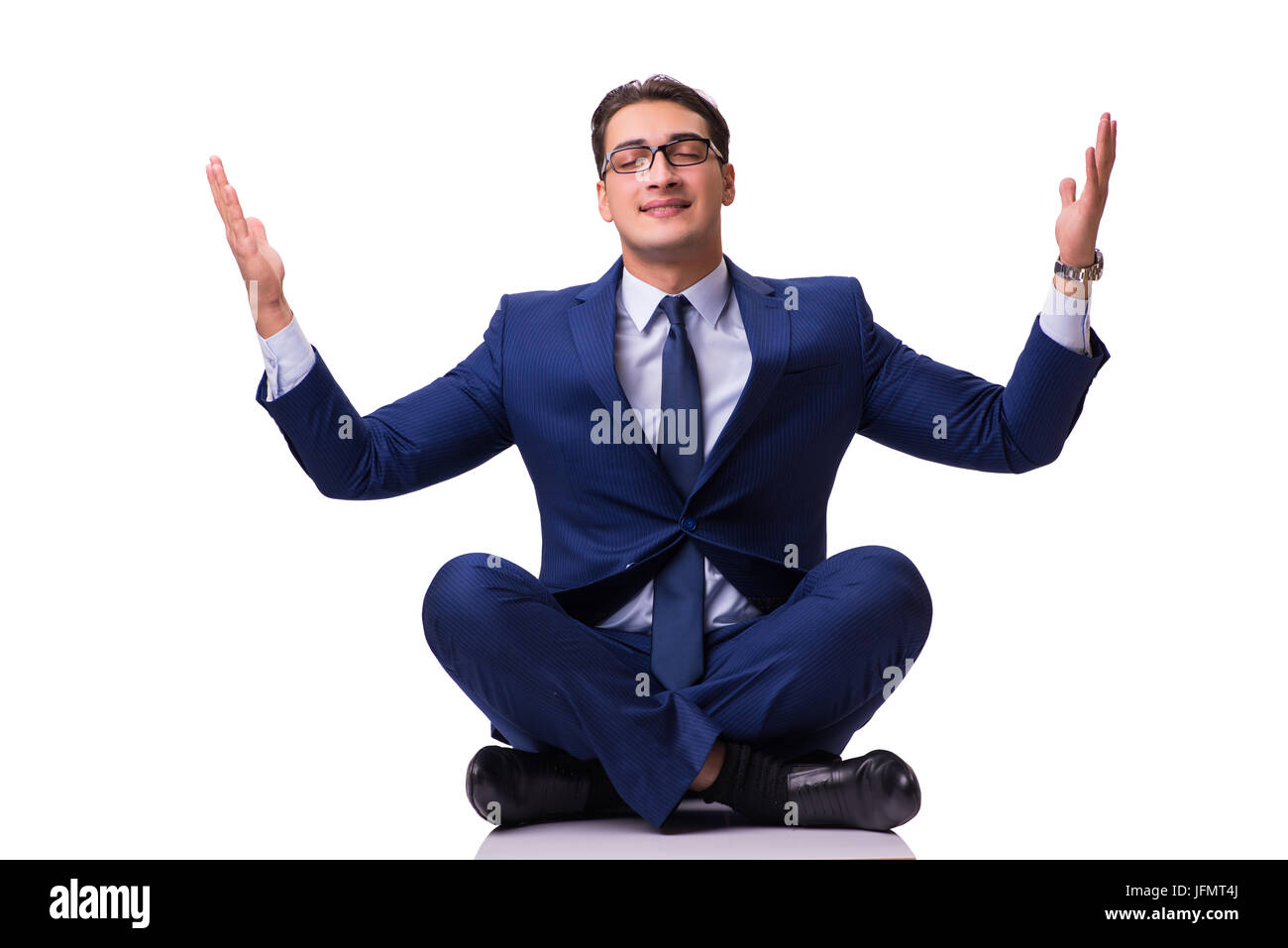 Businessman meditating on the floor isolated on white Stock Photo - Alamy