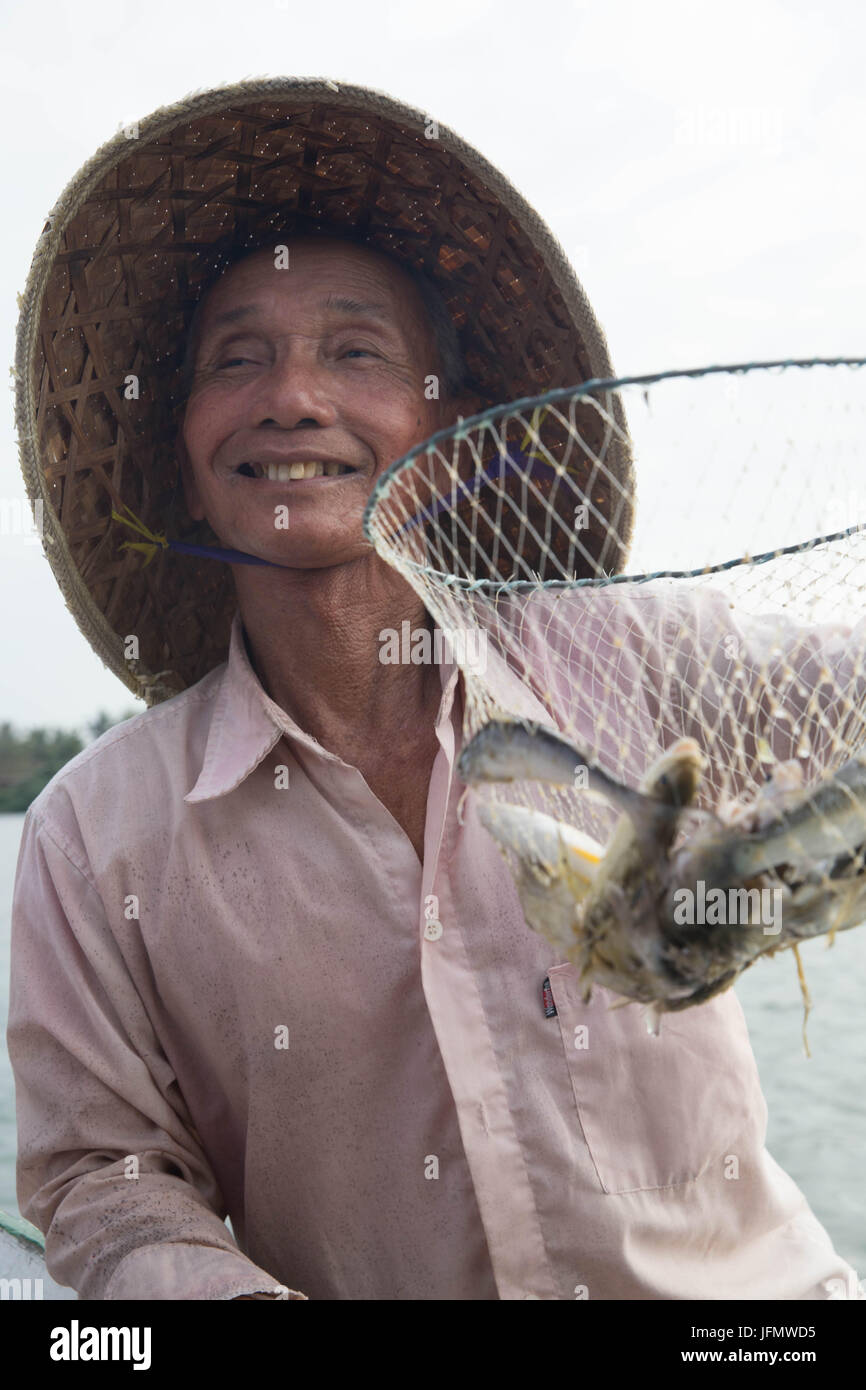 Vietnamese Cheerful Fisherman Stock Photo
