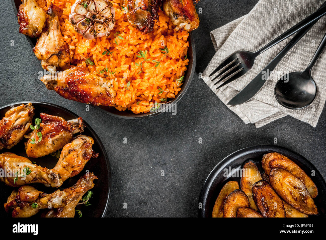 West African national cuisine. Jollof rice with grilled chicken wings