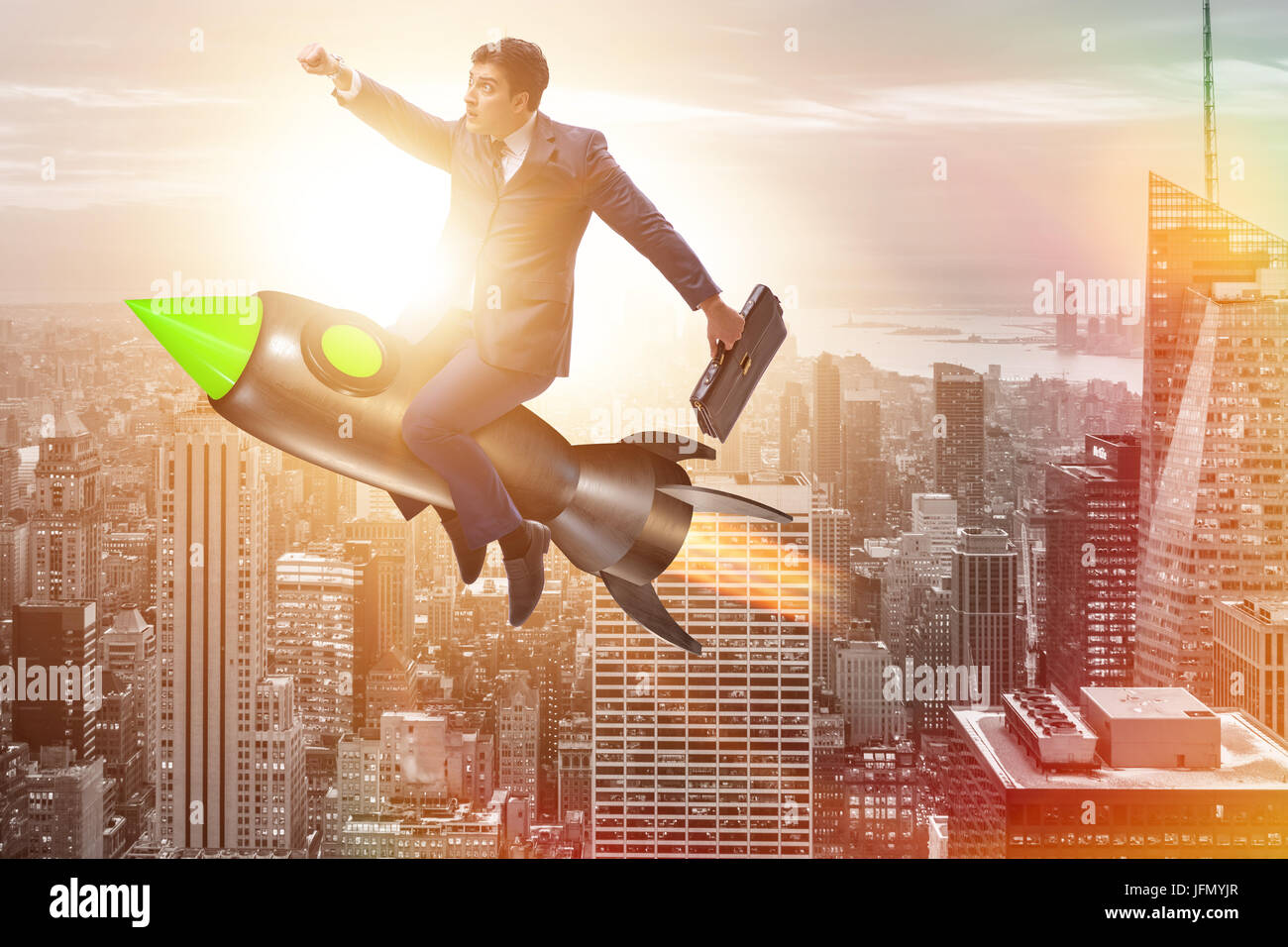 The male businessman flying on rocket in business concept Stock Photo ...