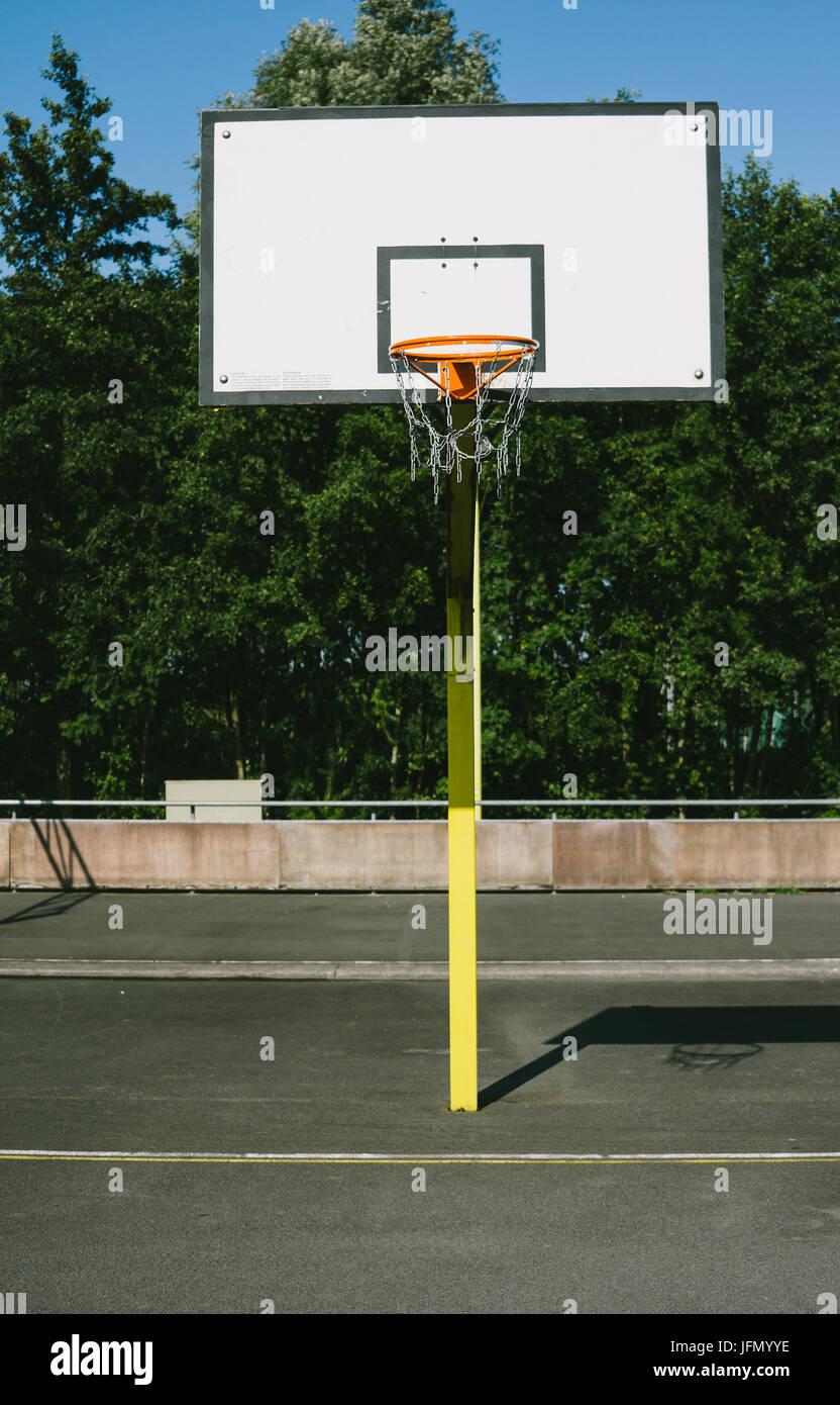 Basketball ring in an outdoors sports field Stock Photo Alamy