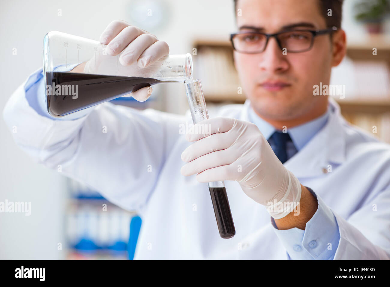 The chemical engineer working on oil samples in lab Stock Photo - Alamy