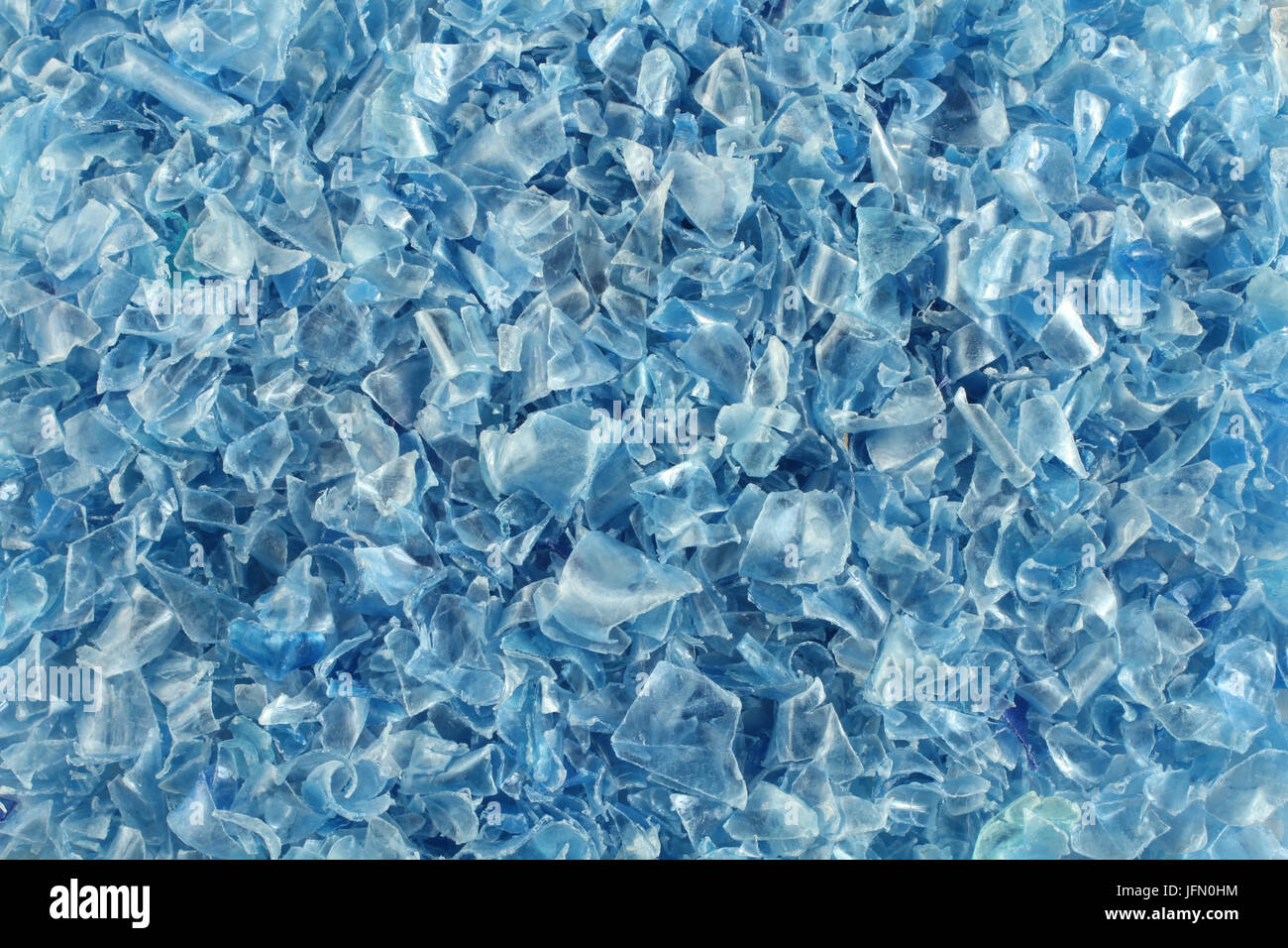 Small pieces of cut blue plastic bottles Stock Photo