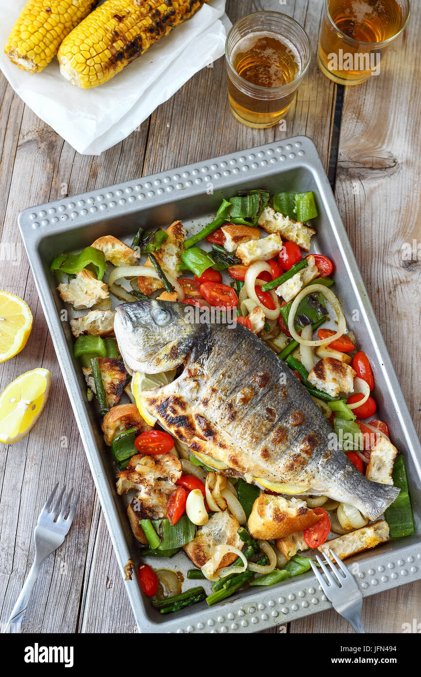 Grilled Whole Fish with Mediterranean Salad Stock Photo - Alamy