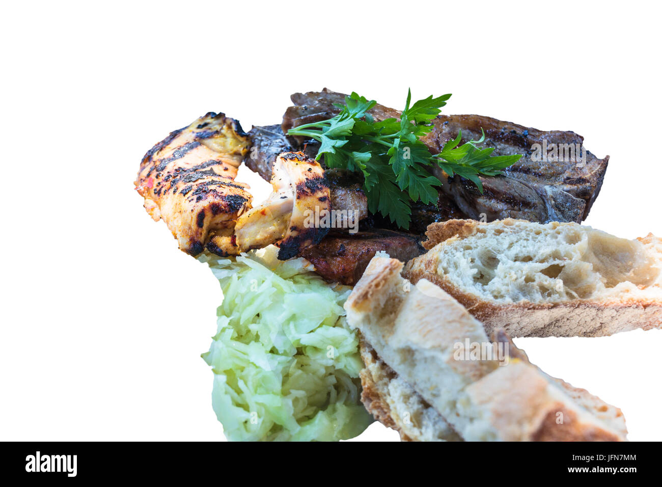 Fresh grilled meats variety meats with bread and coleslaw. Stock Photo