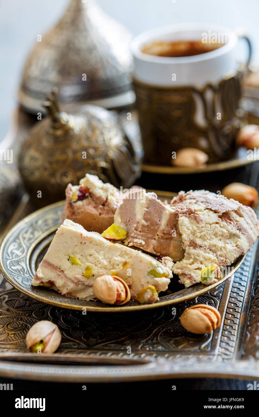 Turkish coffee and tahini halva with cocoa and pistachios Stock Photo