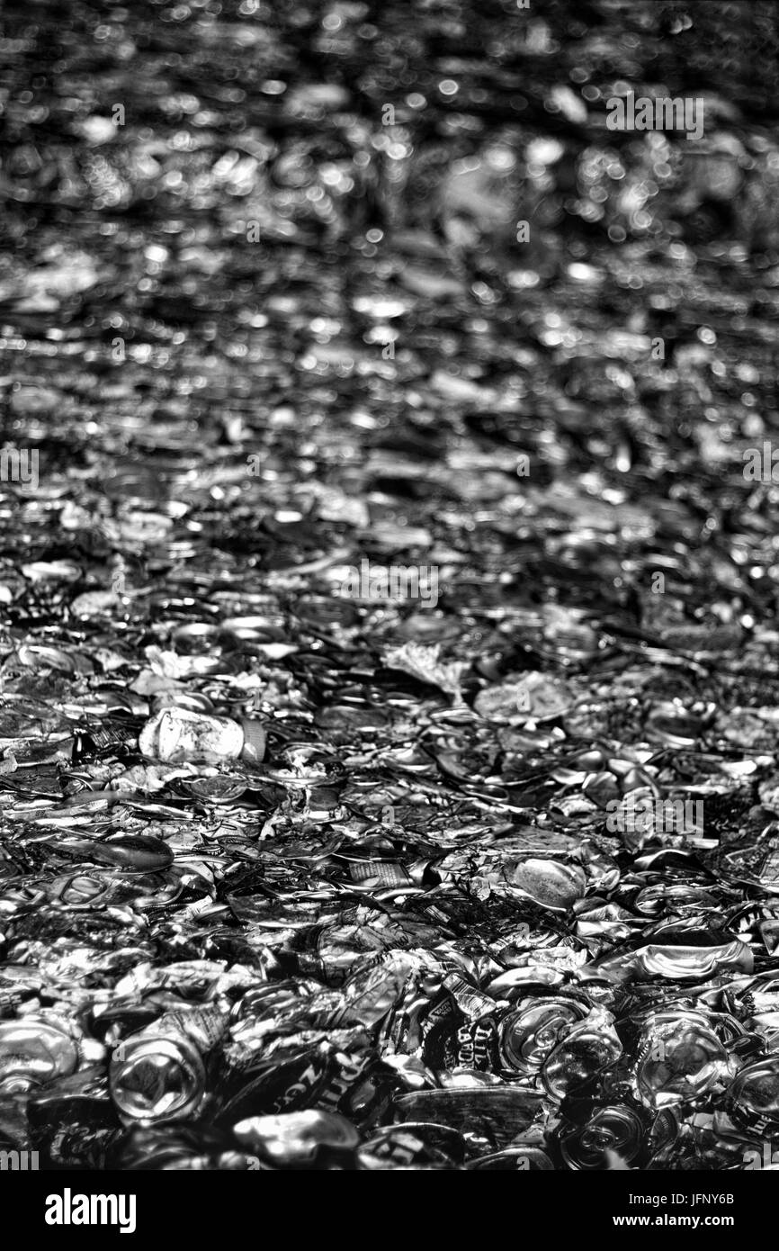 view of crushed cans going from focused to unfocused in the distance Stock Photo