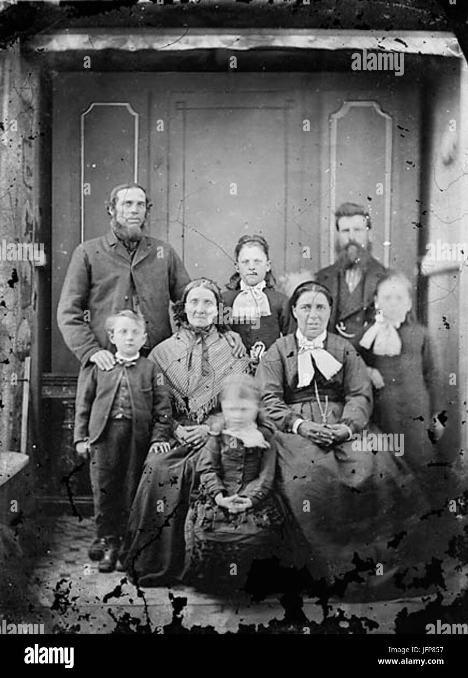 A group including two men two women and four children NLW3364825 Stock Photo
