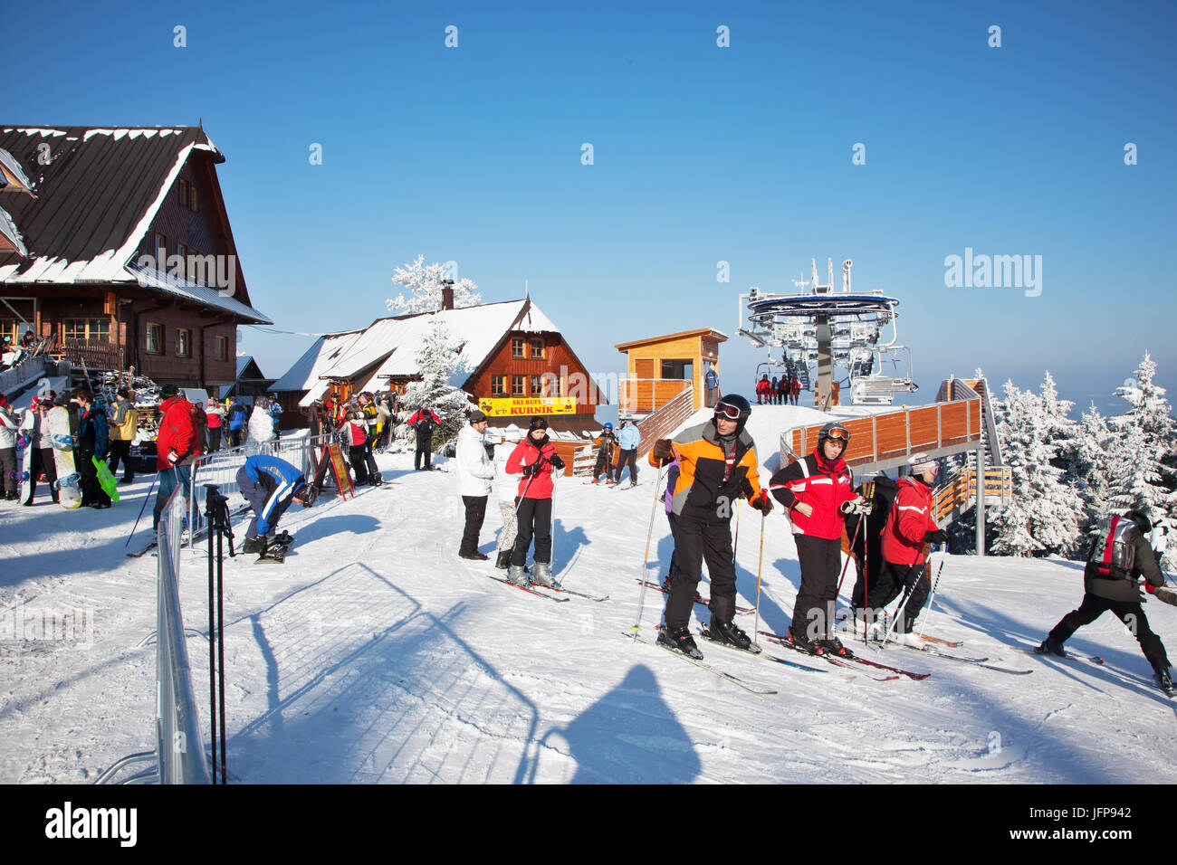 Skiers prepare for descent on skis Stock Photo