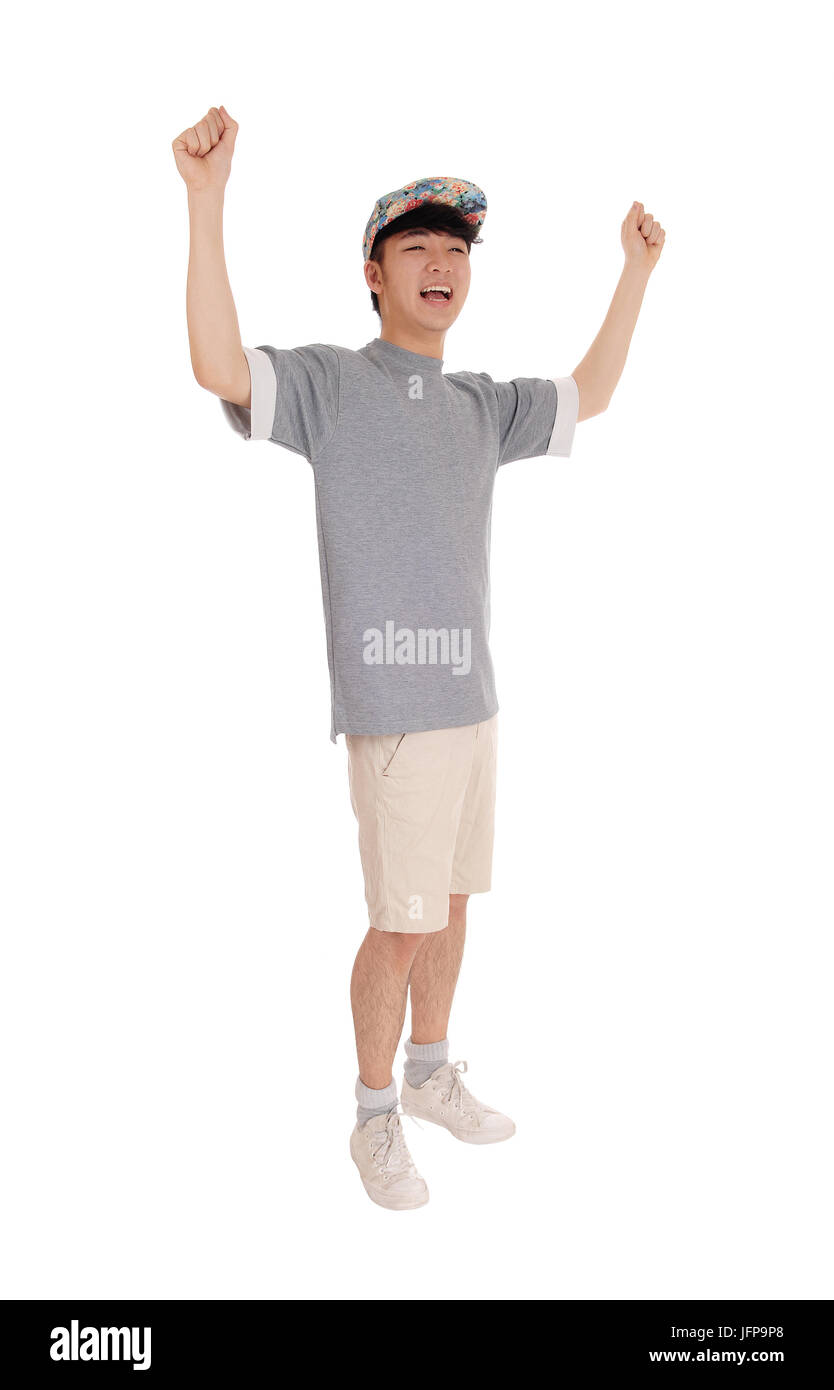 Happy Asian man with arms raised. Stock Photo
