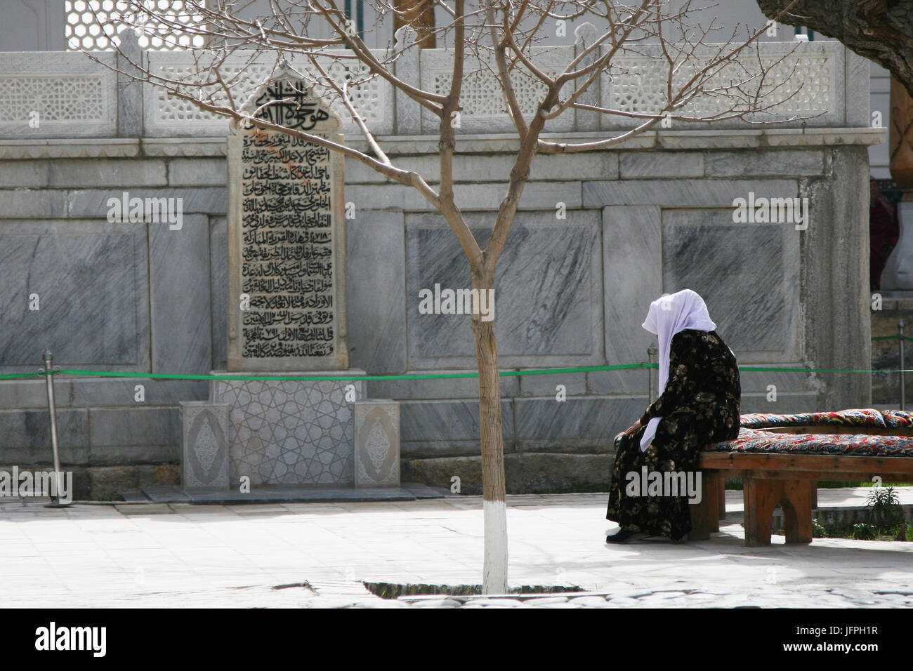 Old Woman Praying , Bukhara, Uzbekistan Stock Photo