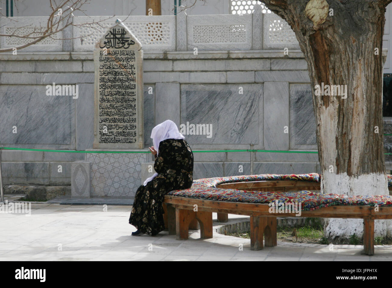 Old Woman Praying , Bukhara, Uzbekistan Stock Photo