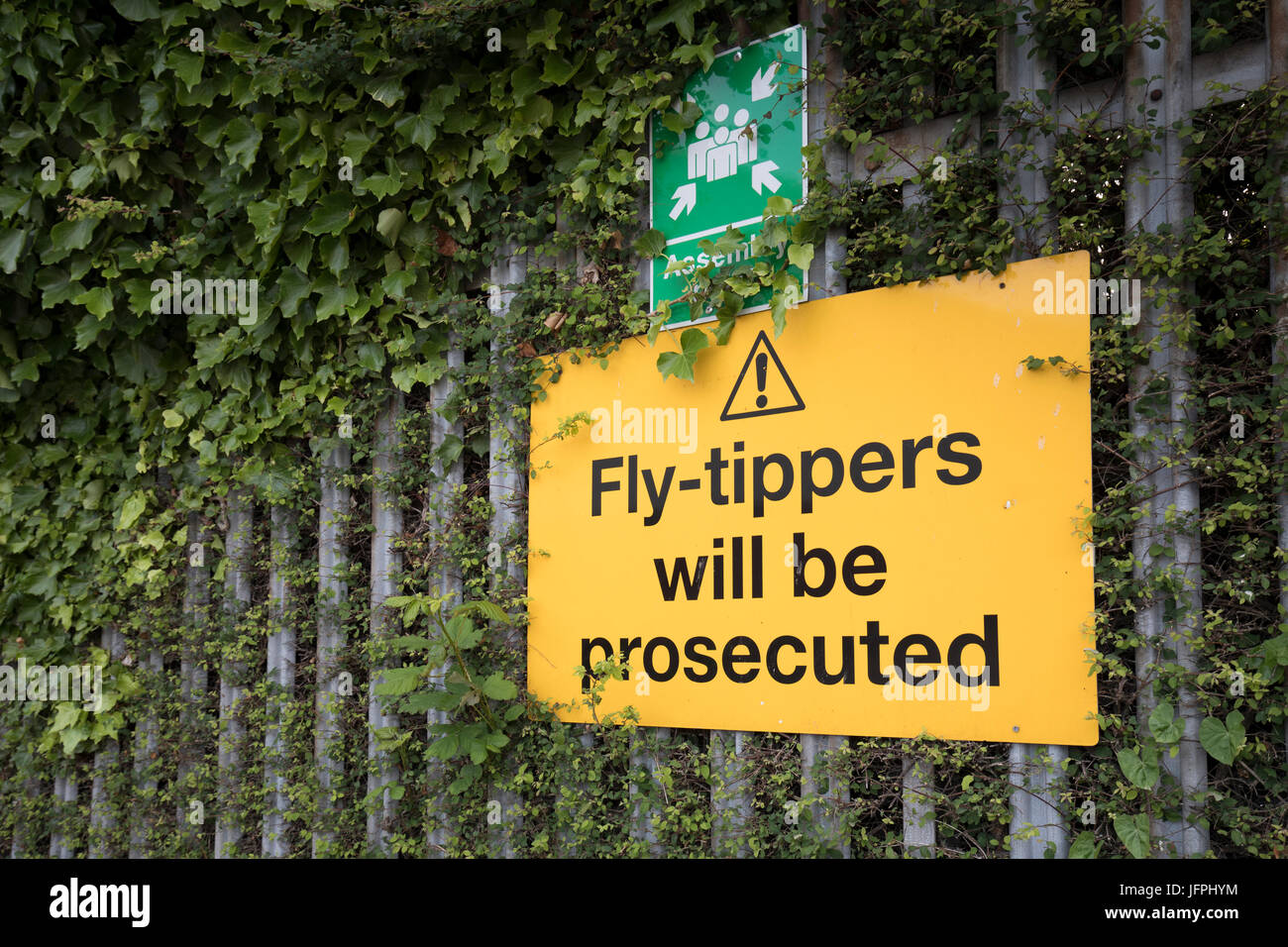 Fly tippers will be prosecuted sign on fence, Cardiff, Wales, UK Stock Photo