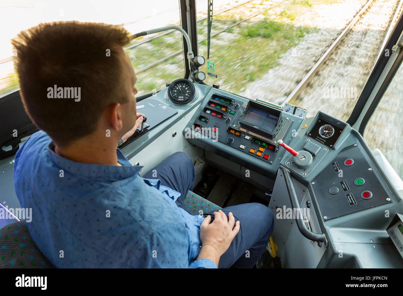Sofia, Bulgaria - 28 June, 2017: Public transport driver drives city tram car during a test drive on new tramway cars for journalists. Stock Photo