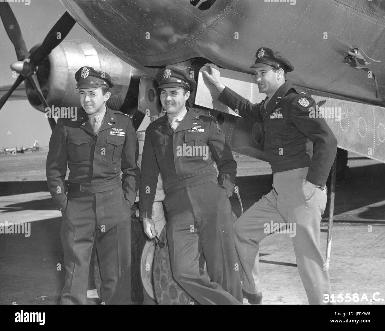Publicity photo of the three officers that dropped the first atom bomb on Japan: From left to right: Maj Theodore J. Van Kirk, navigator on the Hiroshima mission; Col Paul W. Tibbets, pilot, and Maj Tom Ferebee, bombardier. 1945 Stock Photo