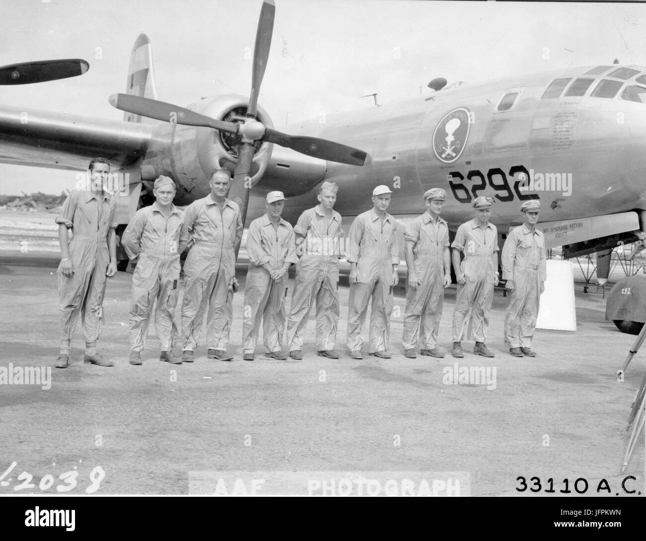 Crew of the Boeing B-29 'ENOLA GAY,' the plane that dropped atomic bomb on Hiroshima. From Left to right are: Sgt T.J. Healey; Sgt C.O. Wentzell; S/Sgt H.E. Osmond; M/sgt W.F. Orren; M/Sgt W. Duzenbury; Lt J. M. Anderson; Maj T. Ferrebee; Maj T. Van Kirk; and Col Paul W. Tibbets. Kwajalein, 13 June 1946. Stock Photo