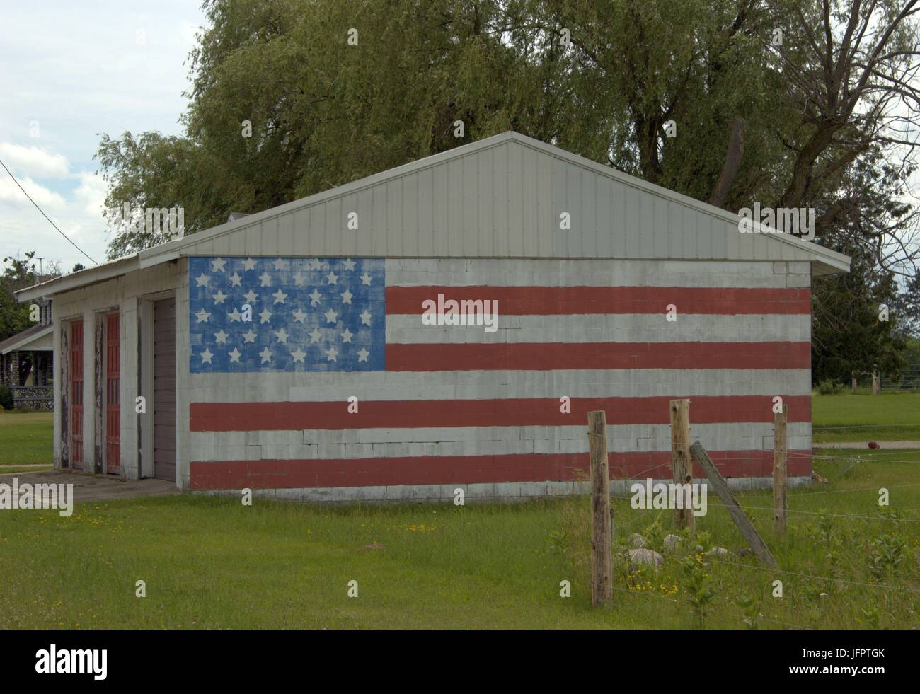 Old Glory On An Old Garage Stock Photo