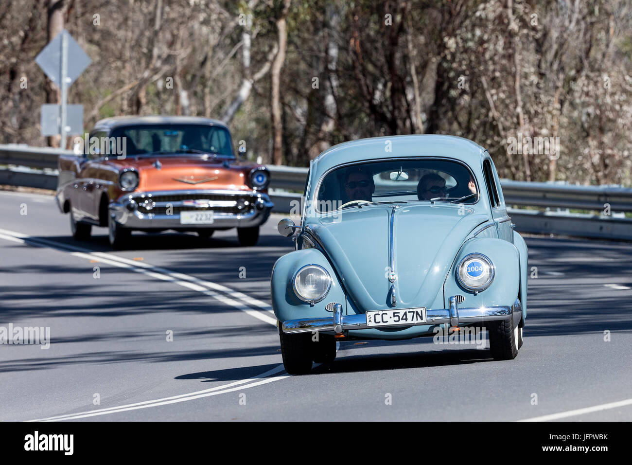Vintage Volkswagen Beetle driving on country roads near the town of ...