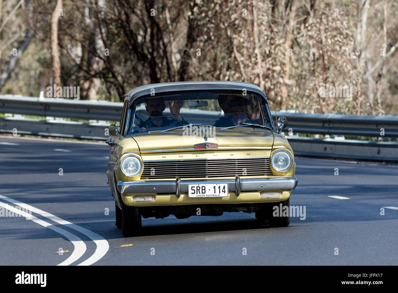 Vintage Holden driving on country roads near the town of Birdwood, South Australia. Stock Photo